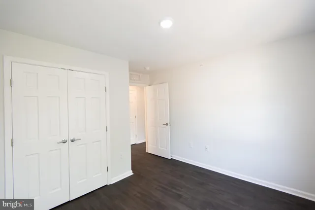 an empty room with wooden floor