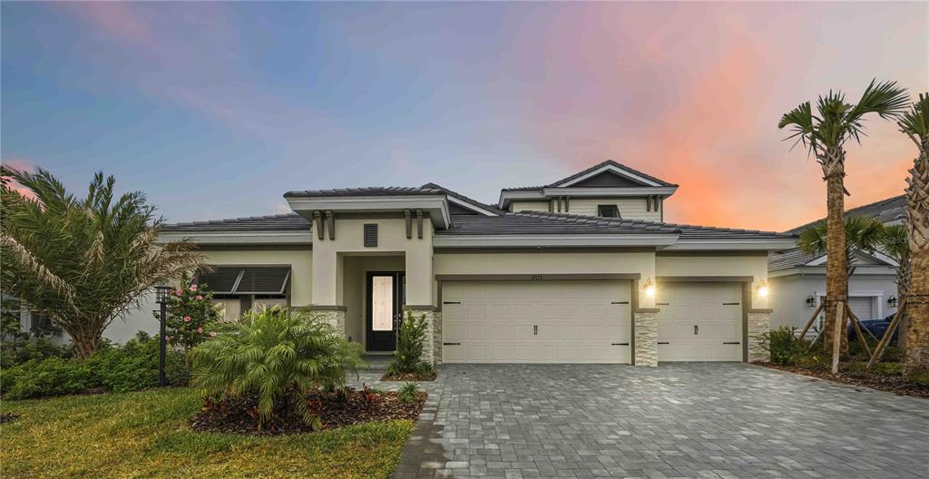 17115 Ranchside Place Lakewood Ranch, FL 34211 - Photo 1 of 1 front view of a house with a yard
