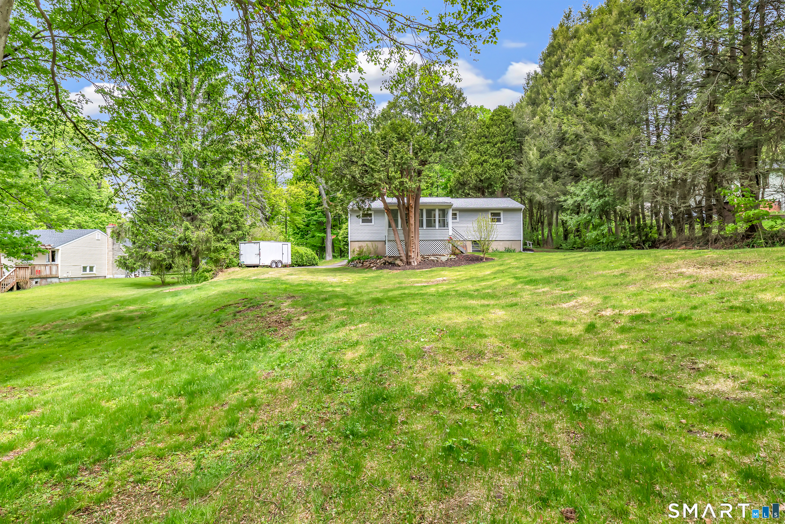 7 Longview Road Newtown, CT 06482 - Photo 34 of 40 a house view with a garden space