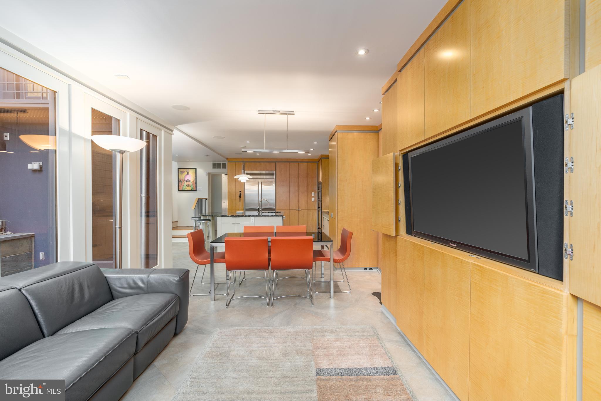 1507 33rd Street Northwest Washington, DC 20007 - Photo 21 of 42 FAMILY ROOM WITH LARGE SCREEN TV CABINET