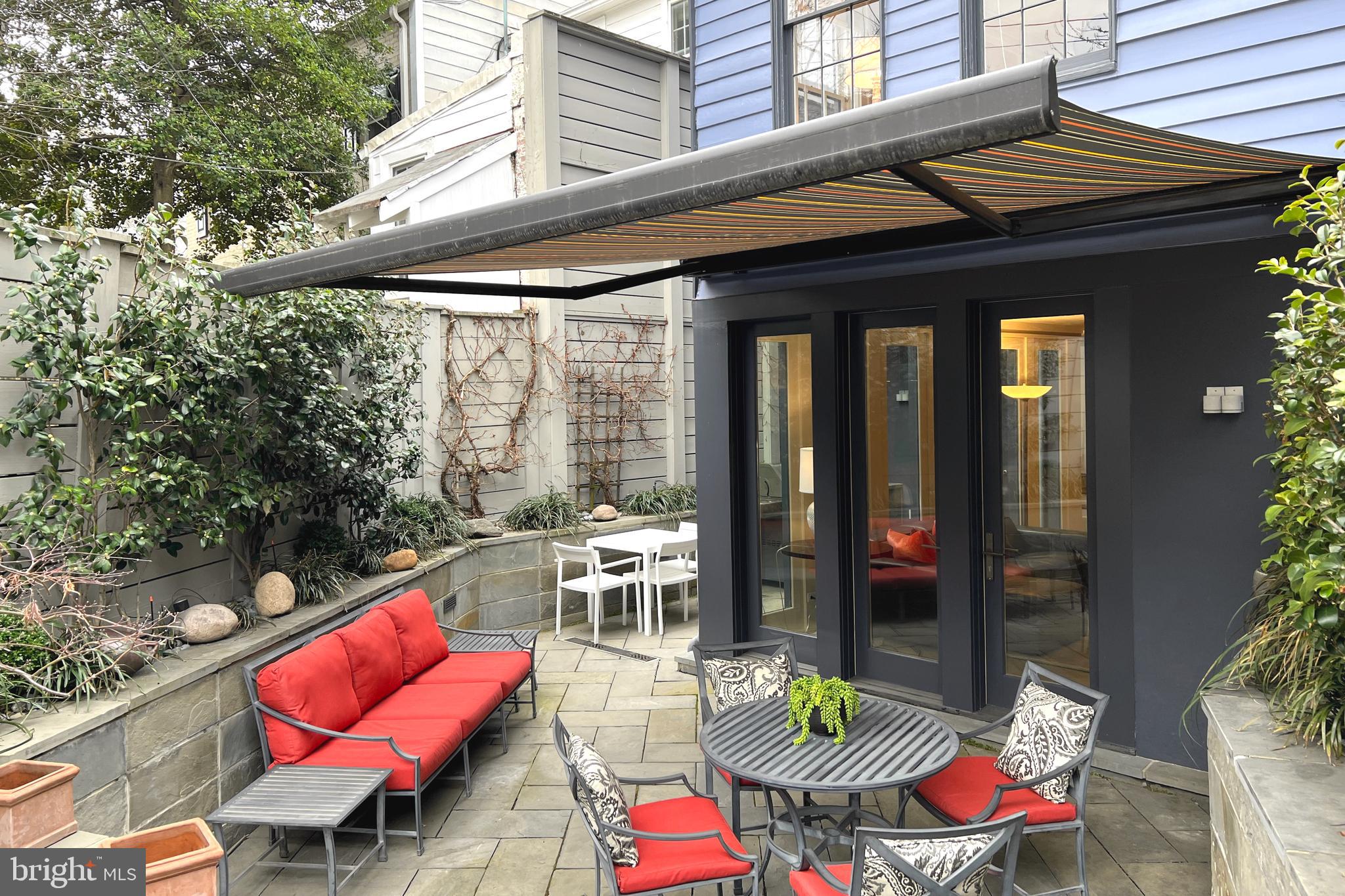 1507 33rd Street Northwest Washington, DC 20007 - Photo 25 of 42 REAR GARDEN WITH RETRACTABLE AWNING