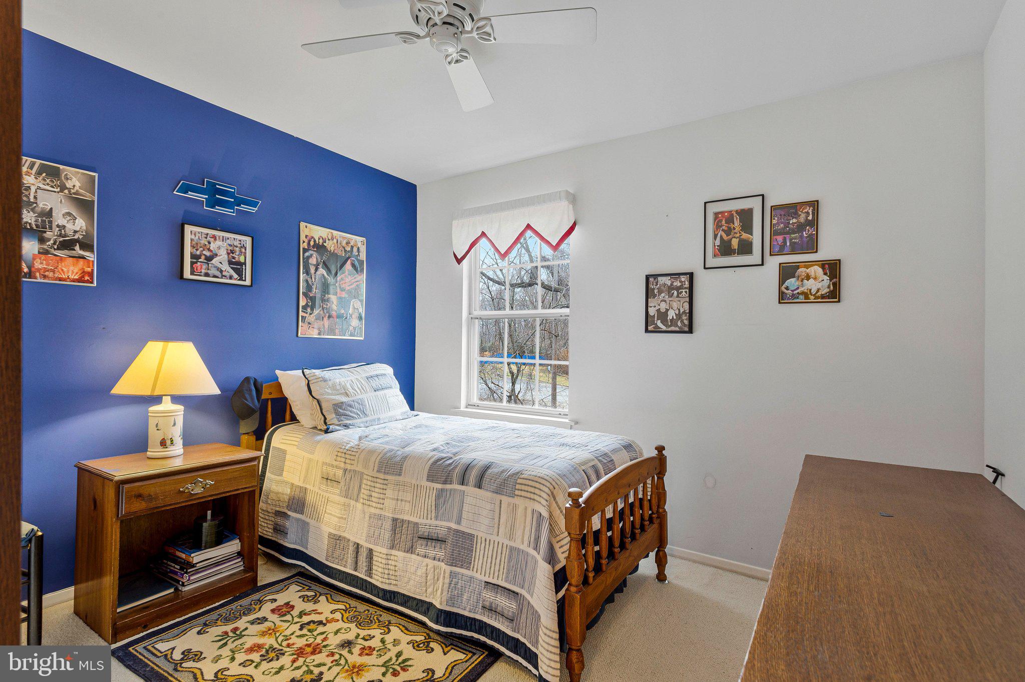 120 Claiborne Road Edgewater, MD 21037 - Photo 12 of 16 a bedroom with a bed and a window