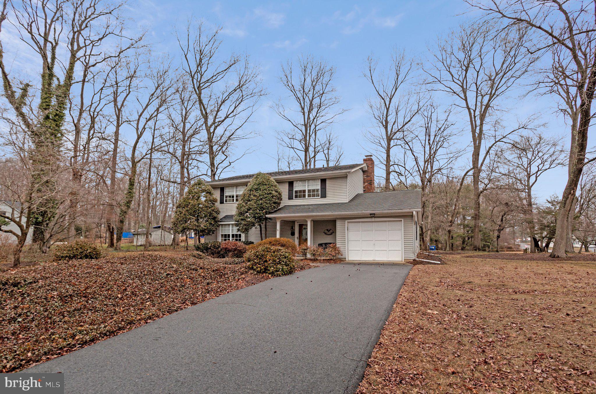 120 Claiborne Road Edgewater, MD 21037 - Photo 16 of 16 a front view of a house with a yard covered with snow