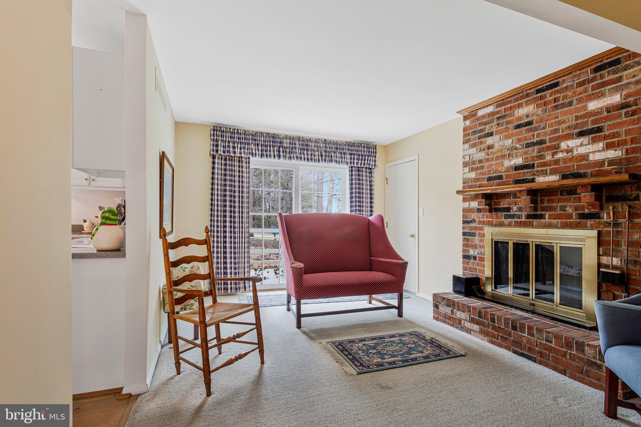 120 Claiborne Road Edgewater, MD 21037 - Photo 6 of 16 a living room with furniture and a fireplace