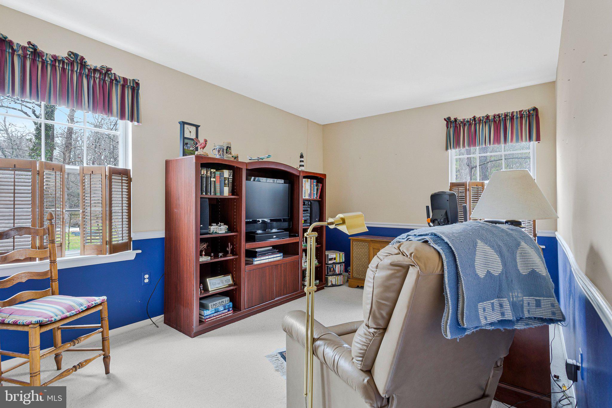 120 Claiborne Road Edgewater, MD 21037 - Photo 7 of 16 a bedroom with furniture and a flat screen tv