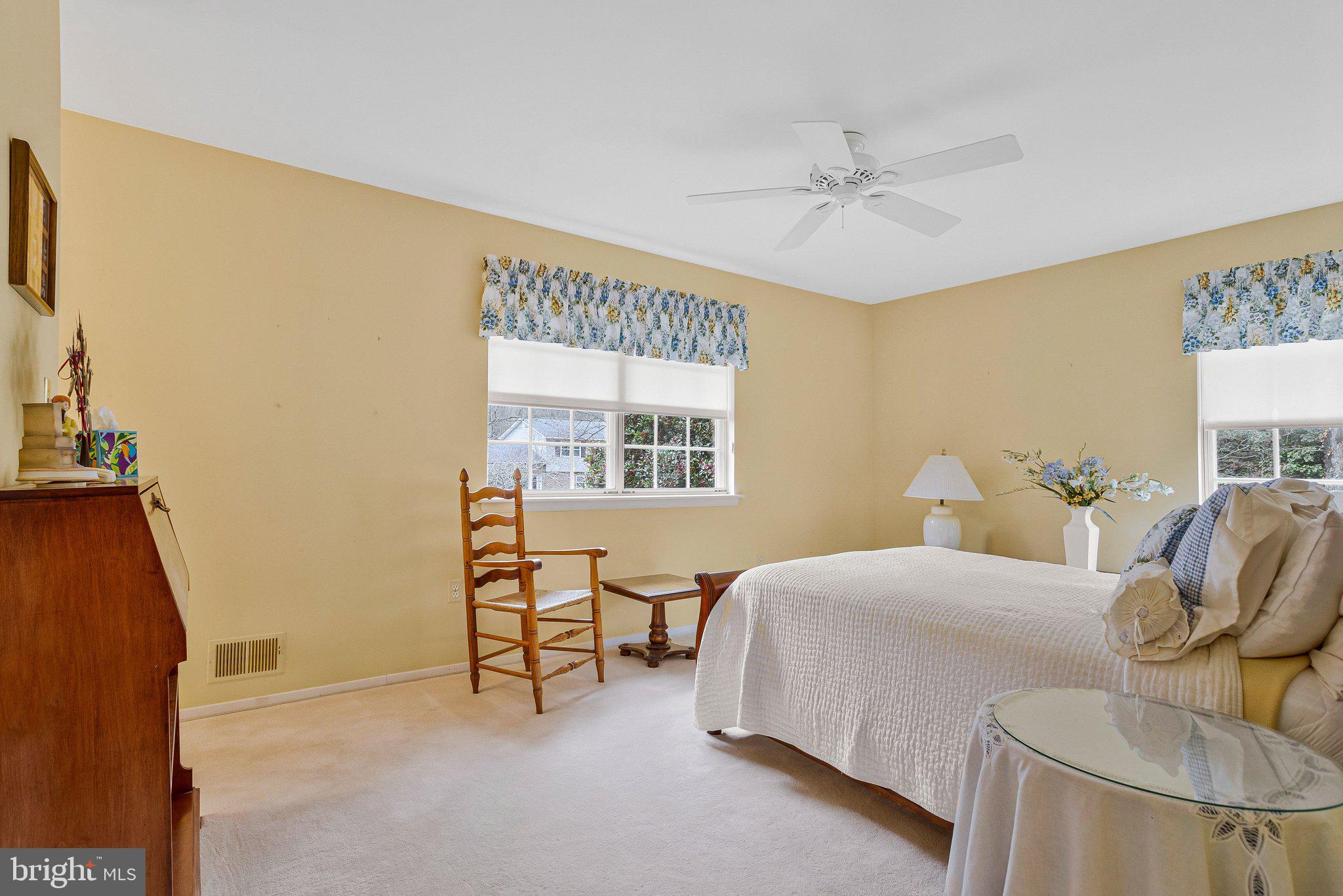 120 Claiborne Road Edgewater, MD 21037 - Photo 8 of 16 a bedroom with a bed and a chair