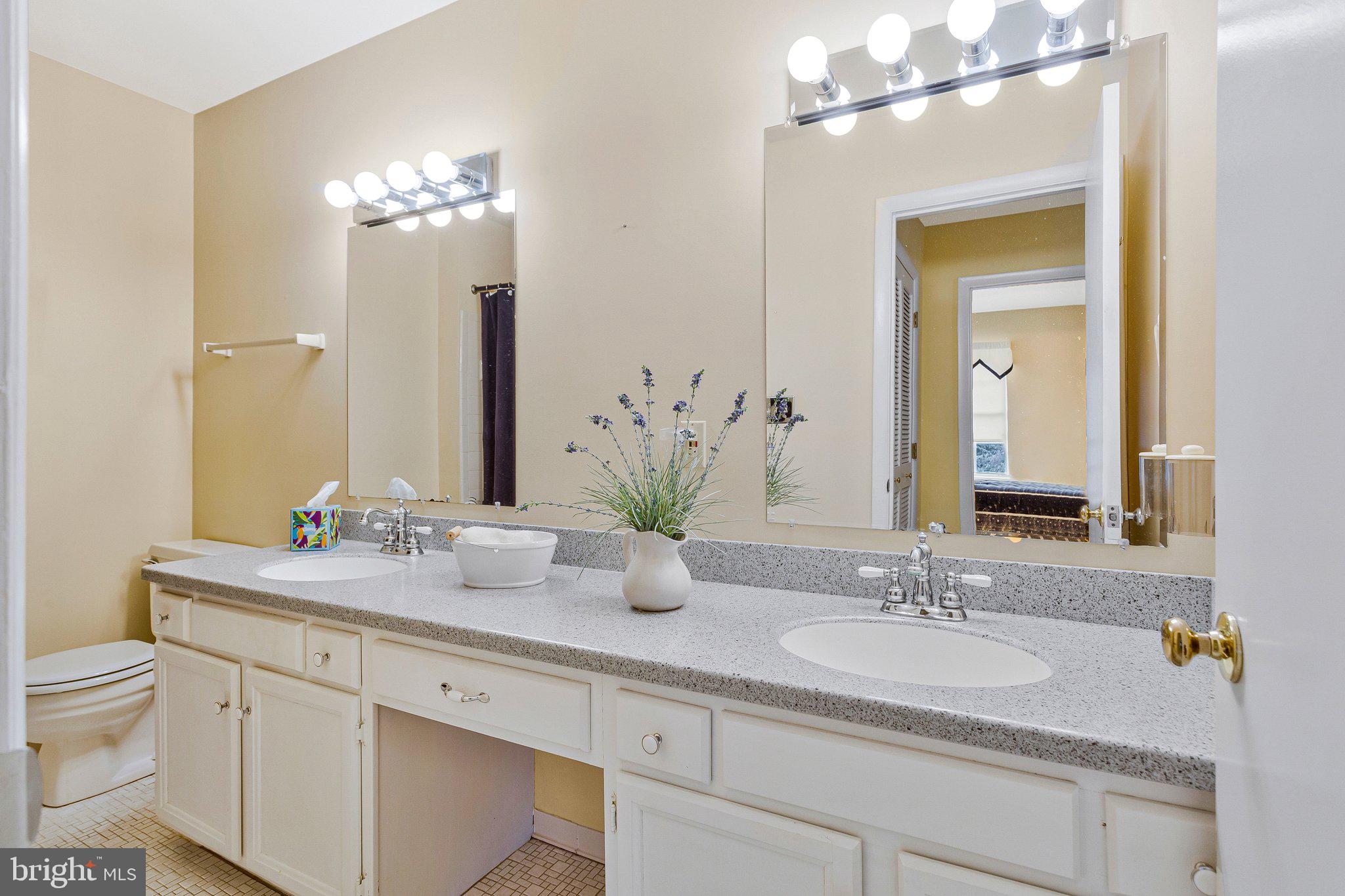 120 Claiborne Road Edgewater, MD 21037 - Photo 9 of 16 a bathroom with a sink double vanity and a mirror