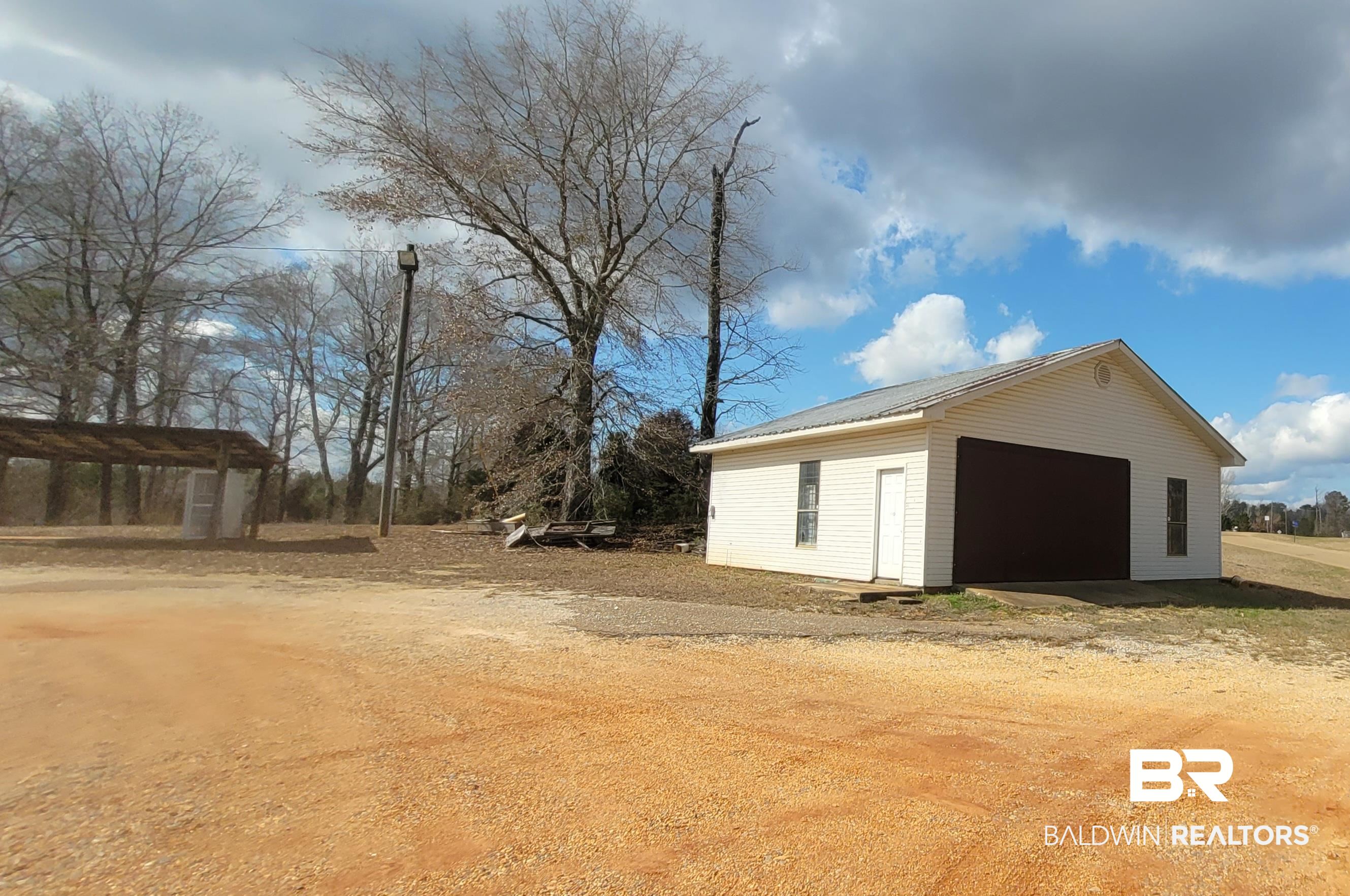 2777 Highway 83 Evergreen, AL 36401 - Photo 13 of 14 Detached garage featuring driveway