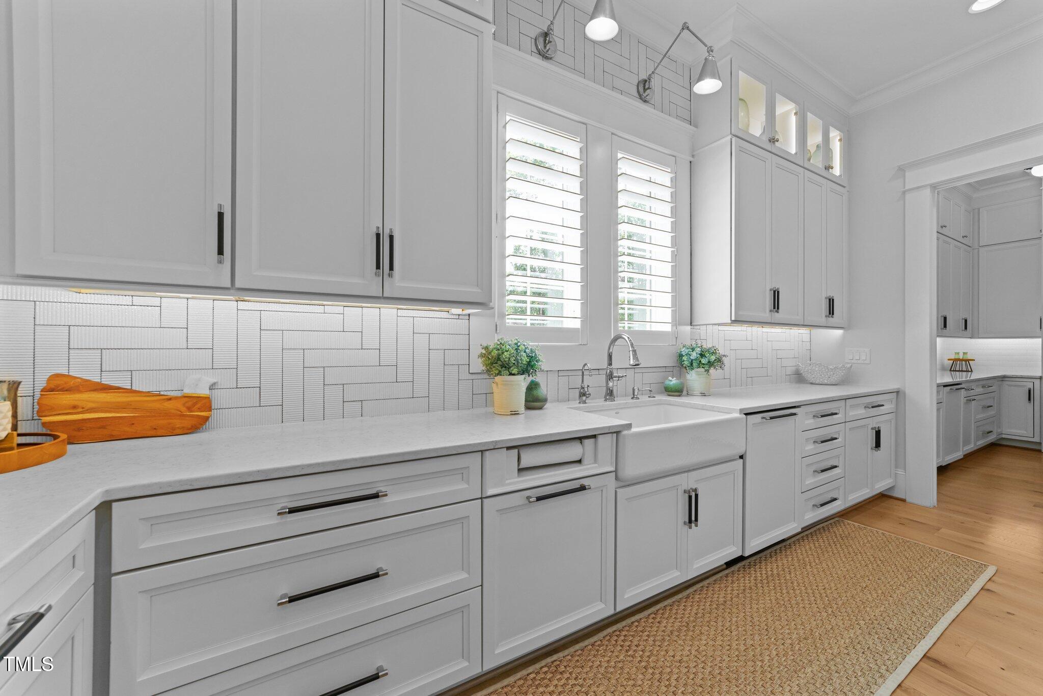1208 Hunting Ridge Road Raleigh, NC 27615 - Photo 14 of 71 a kitchen with granite countertop white cabinets and white appliances