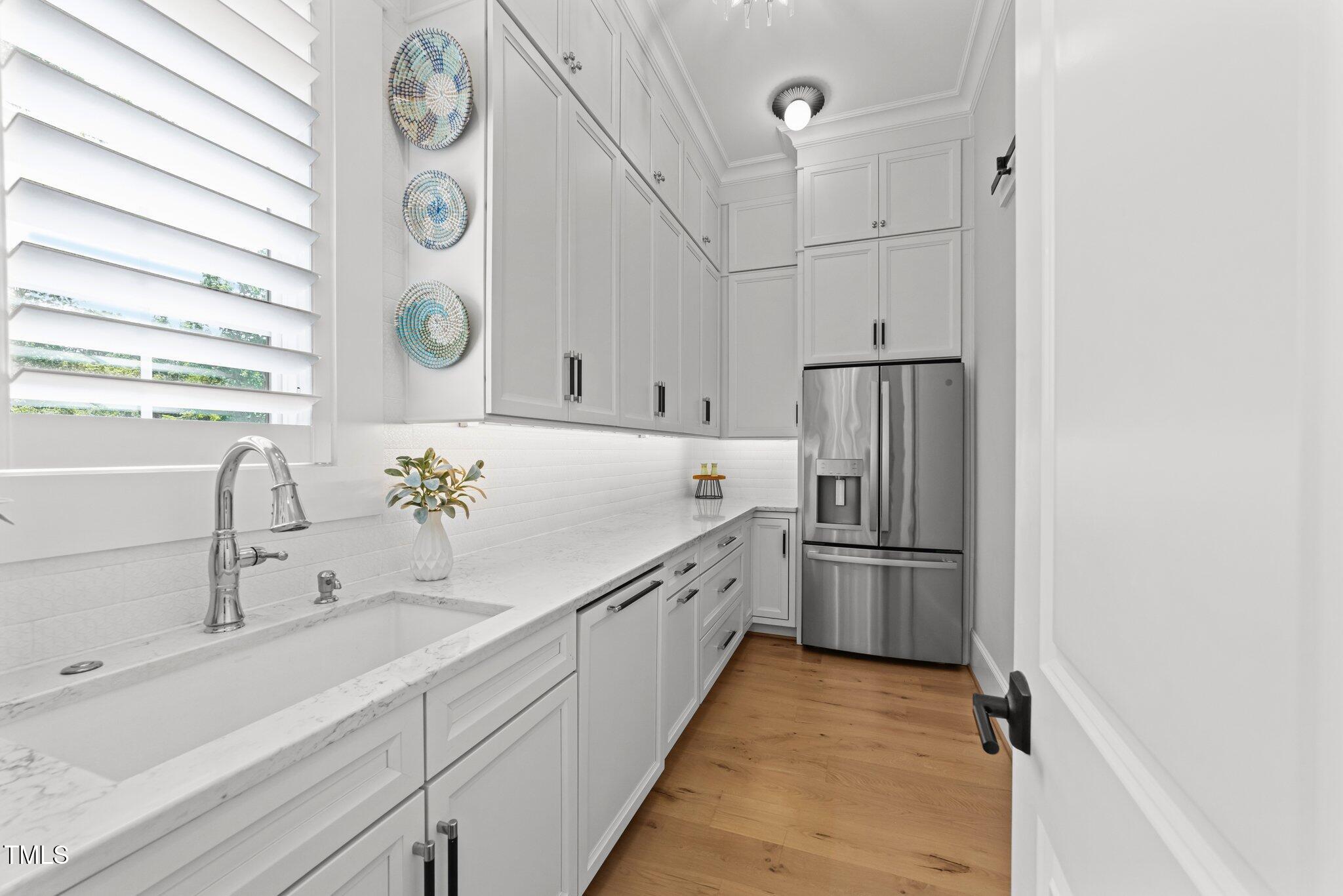 1208 Hunting Ridge Road Raleigh, NC 27615 - Photo 15 of 71 a kitchen with refrigerator and window