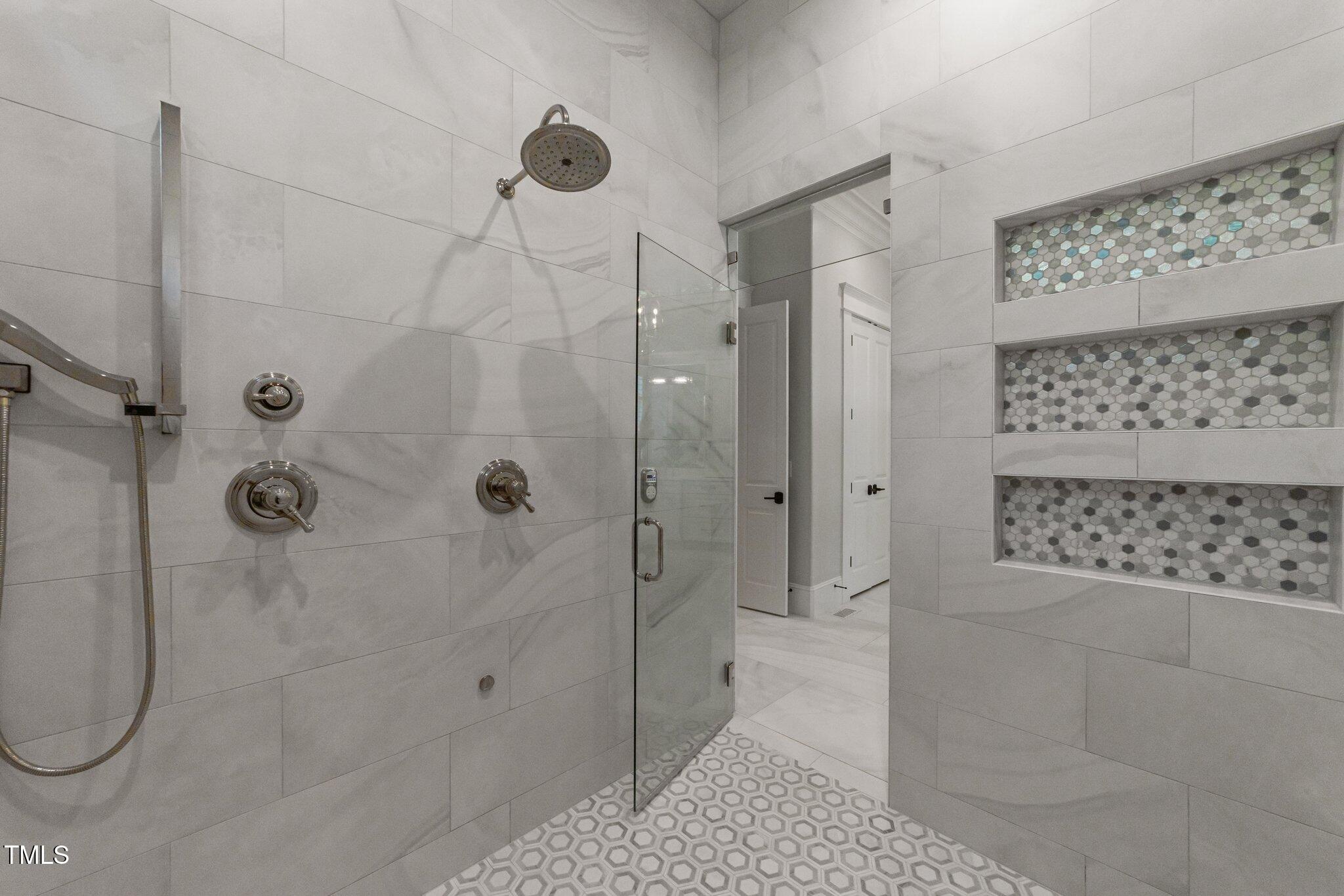 1208 Hunting Ridge Road Raleigh, NC 27615 - Photo 24 of 71 a bathroom with a shower