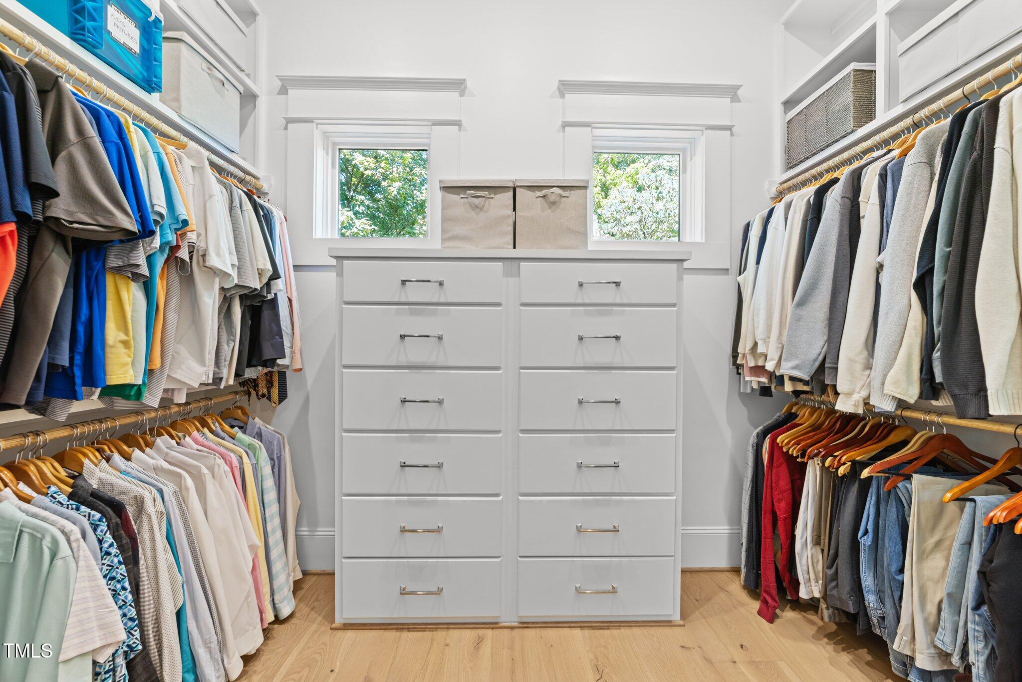 1208 Hunting Ridge Road Raleigh, NC 27615 - Photo 27 of 71 a view of walk in closet with clothes and shoes