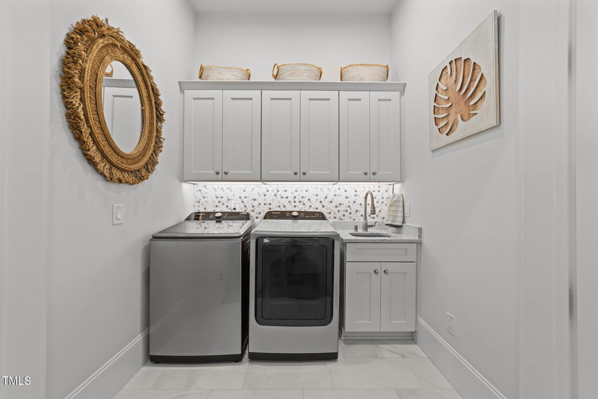 1208 Hunting Ridge Road Raleigh, NC 27615 - Photo 28 of 71 a view of a storage and utility room with washer and dryer