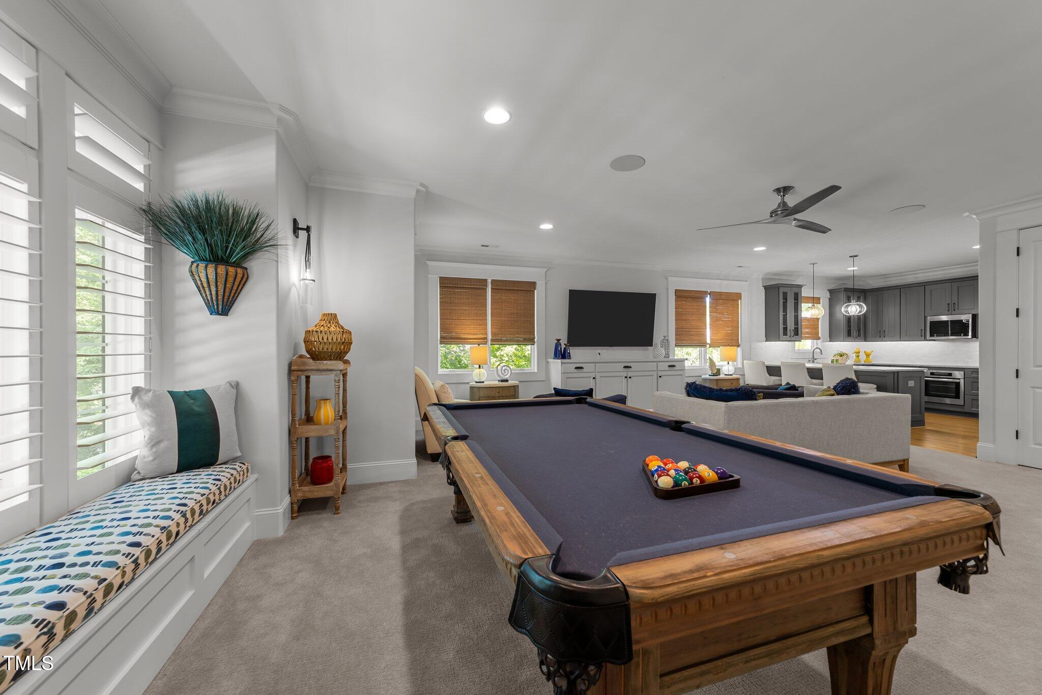 1208 Hunting Ridge Road Raleigh, NC 27615 - Photo 36 of 71 a living room with furniture and a flat screen tv