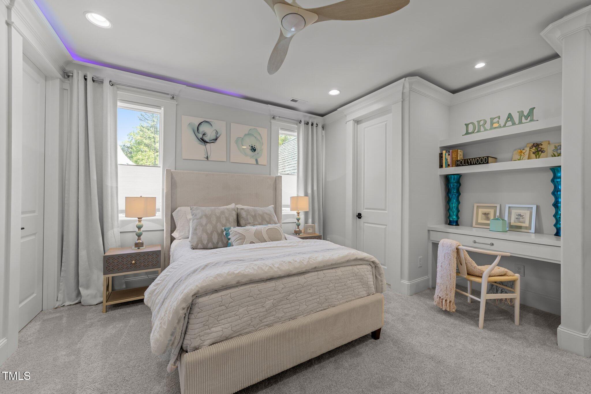 1208 Hunting Ridge Road Raleigh, NC 27615 - Photo 48 of 71 a bedroom with a bed and a table