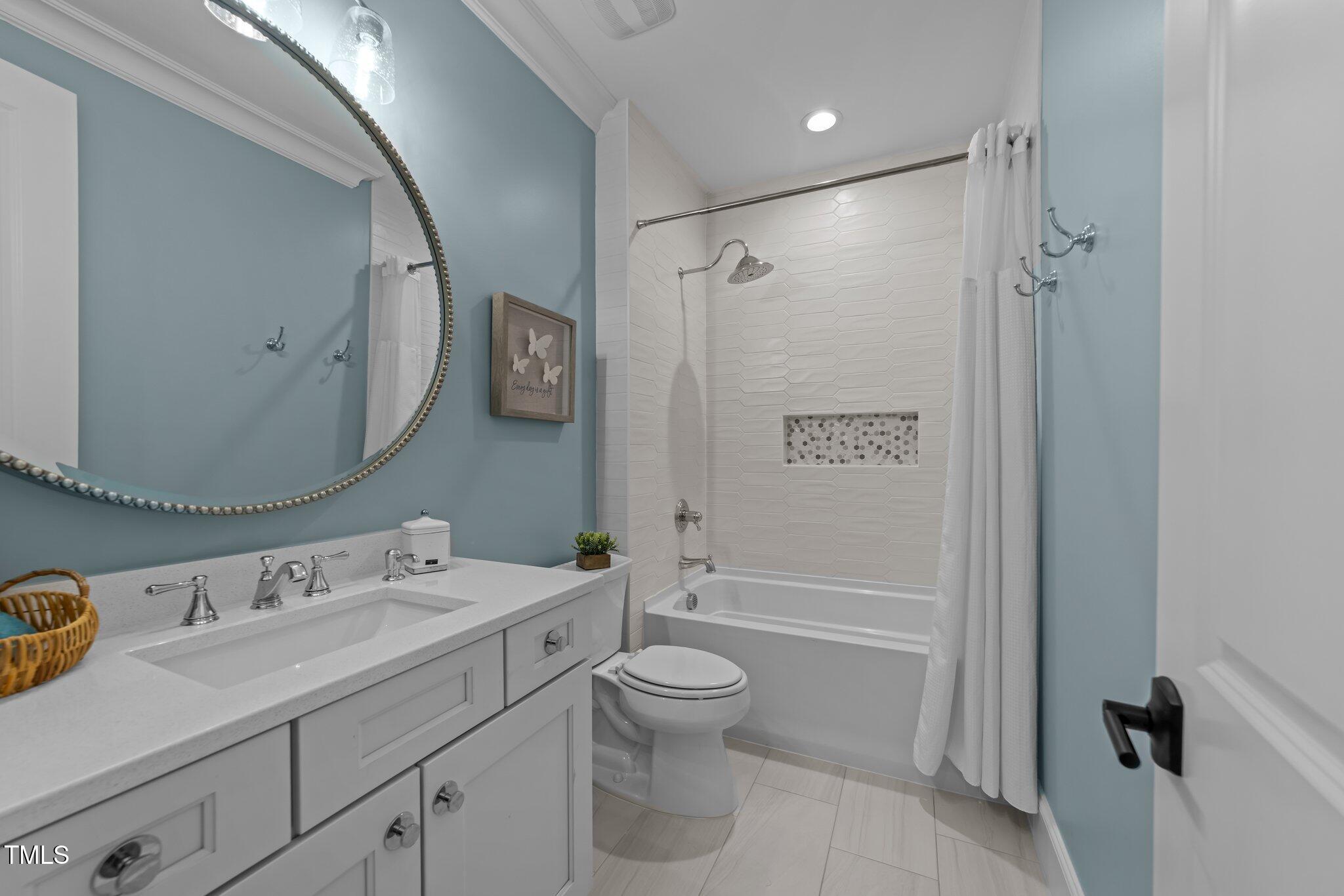 1208 Hunting Ridge Road Raleigh, NC 27615 - Photo 50 of 71 a bathroom with a granite countertop sink toilet and shower