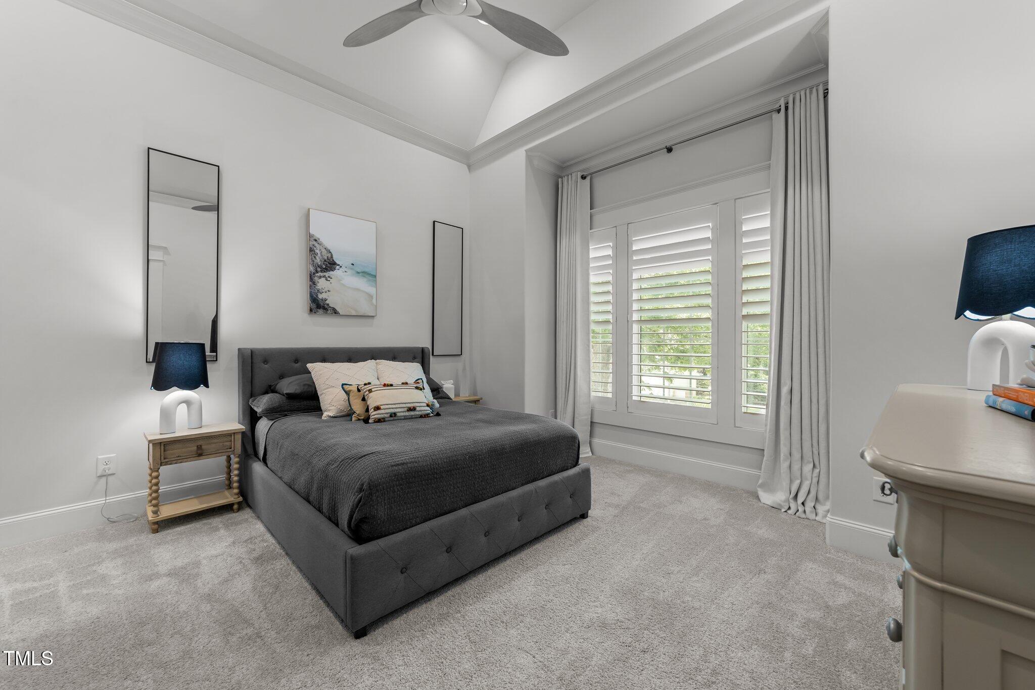 1208 Hunting Ridge Road Raleigh, NC 27615 - Photo 51 of 71 a bedroom with a bed and a flat screen tv