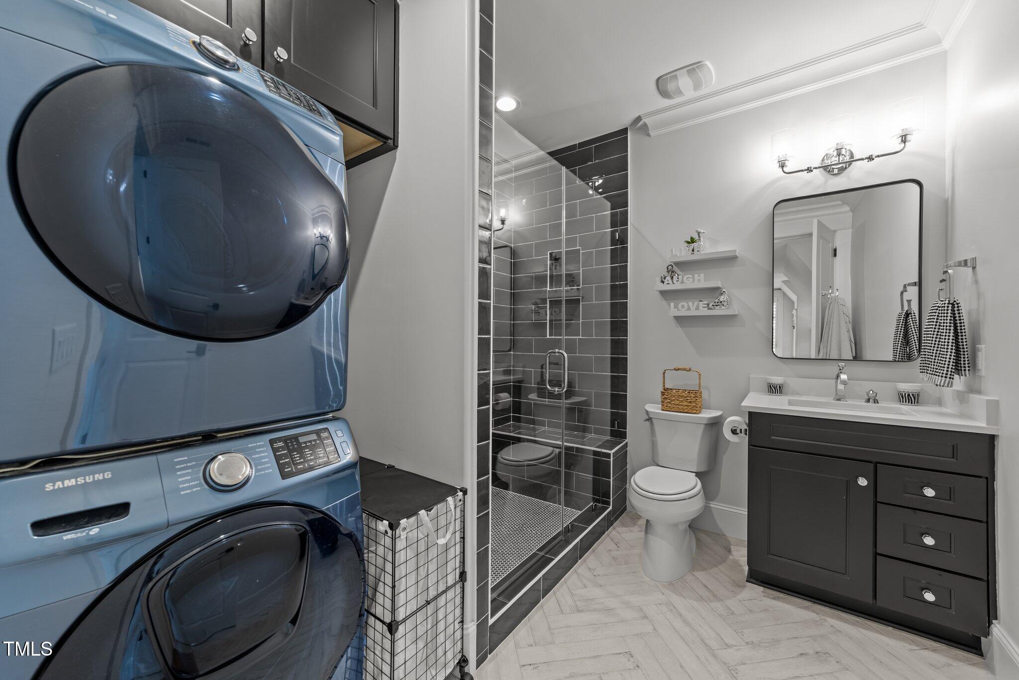 1208 Hunting Ridge Road Raleigh, NC 27615 - Photo 56 of 71 a bathroom with a sink a vanity and mirror
