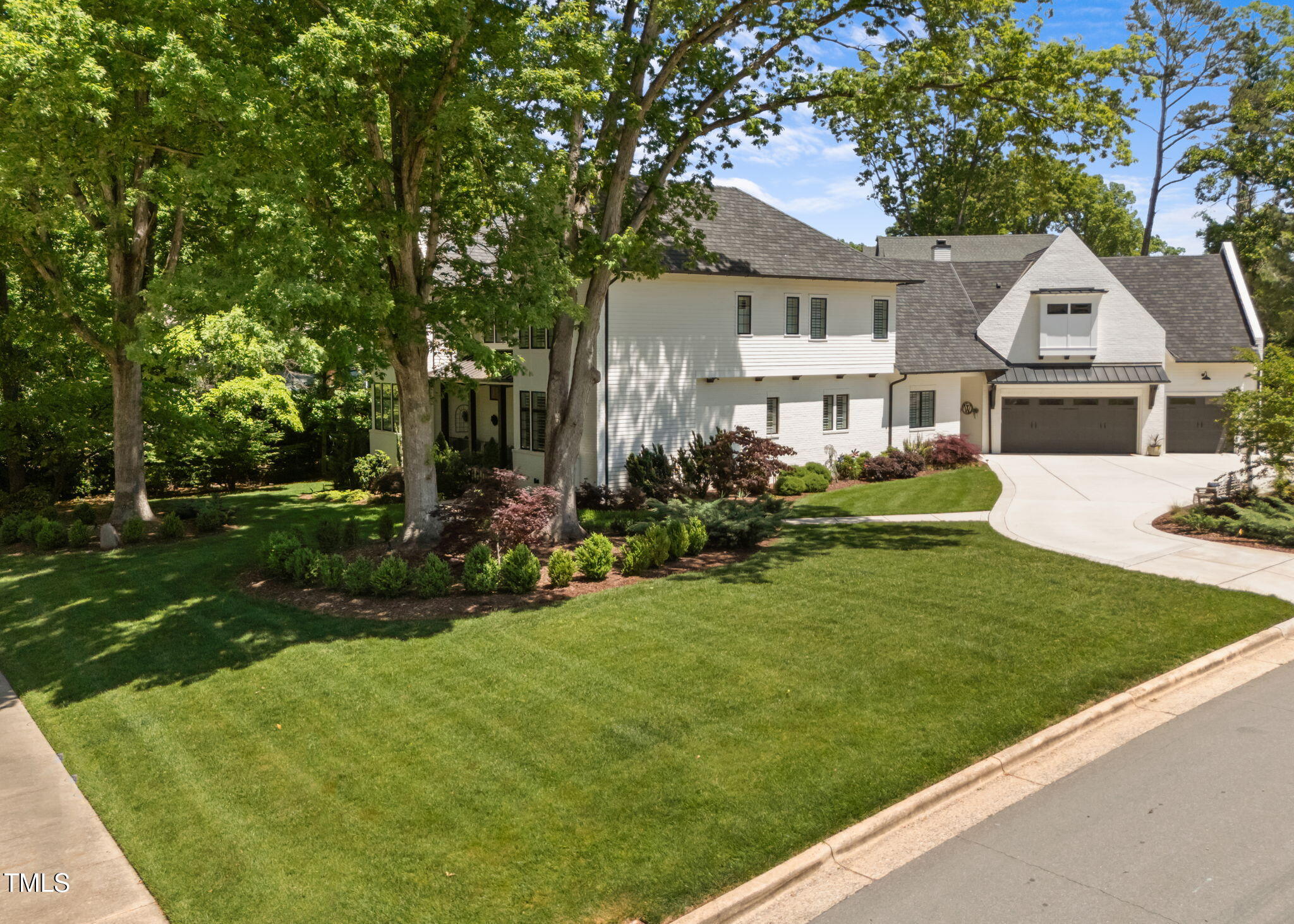 1208 Hunting Ridge Road Raleigh, NC 27615 - Photo 70 of 71 a front view of a house with a yard