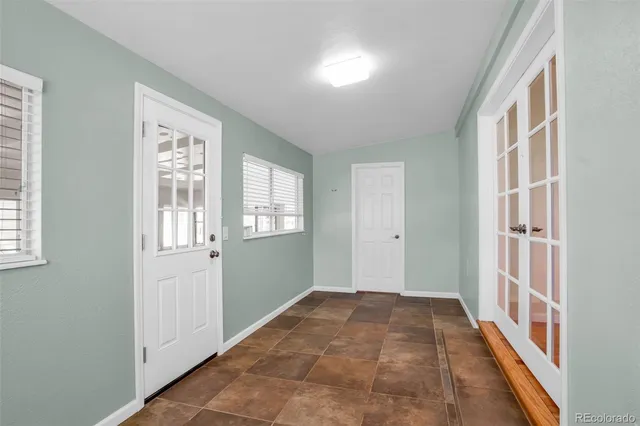 a view of a hallway with windows