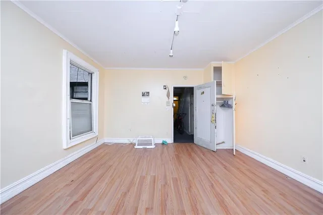 a kitchen with window cabinets and a sink