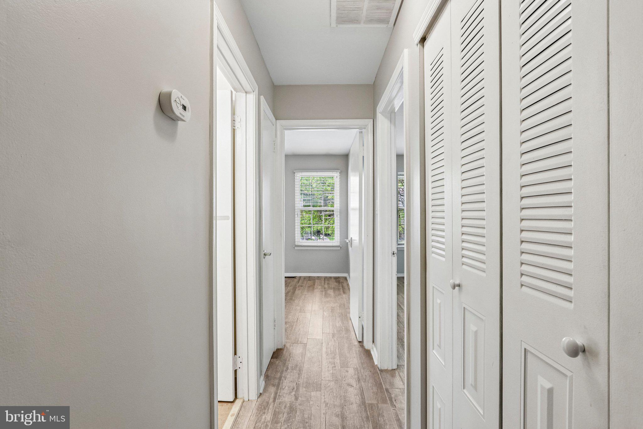 803 Wharton Road Mount Laurel, NJ 08054 - Photo 19 of 48 a view of a hallway with wooden floor and staircase