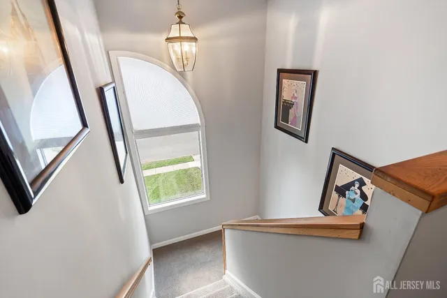 a view of entryway with window and hallway