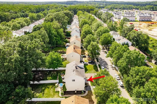an aerial view of house with yard