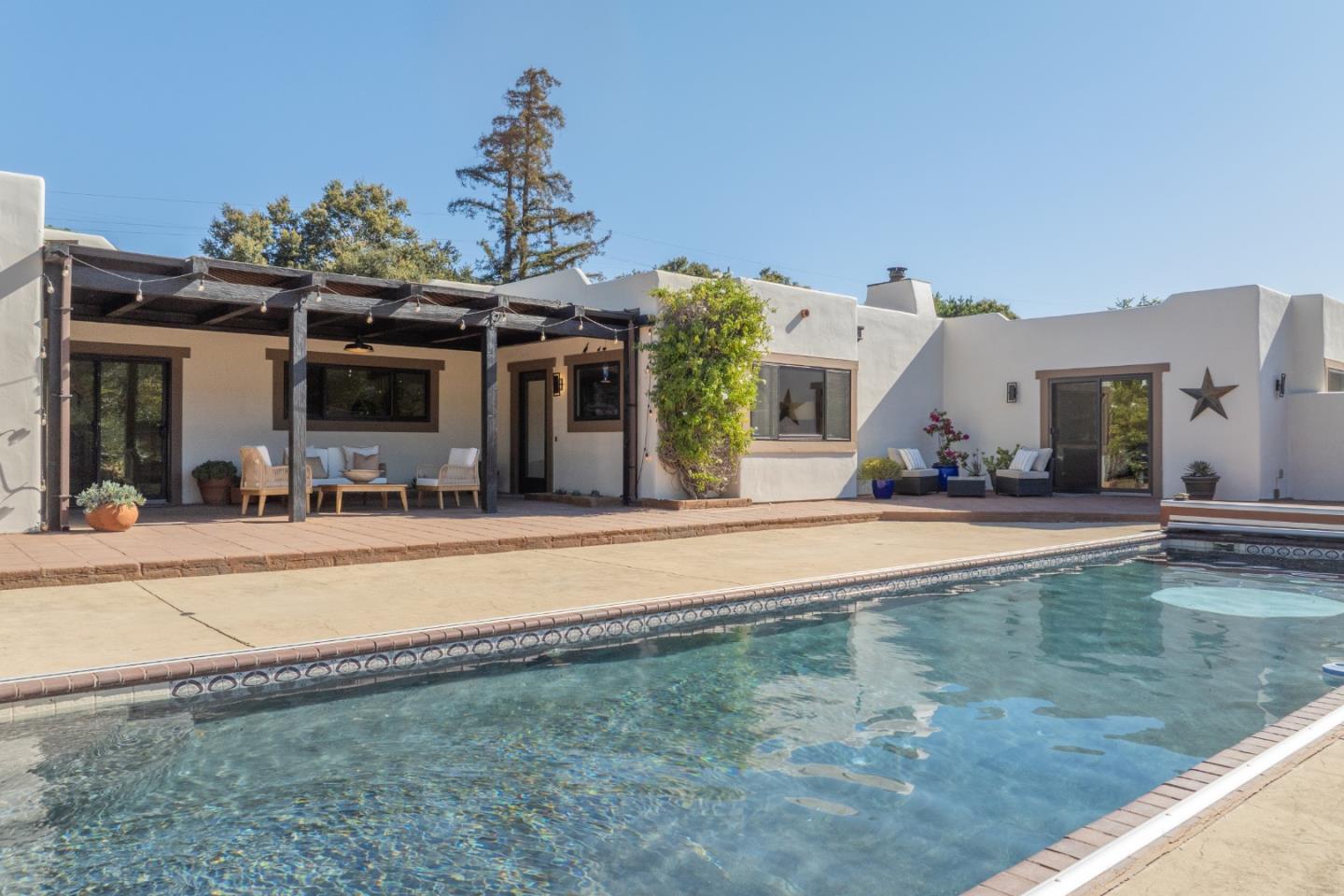 19 El Caminito Road Carmel Valley, CA 93924 - Photo 1 of 50 a view of a house with swimming pool and a porch