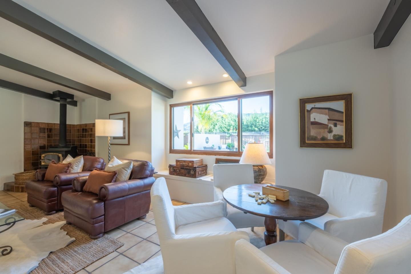 19 El Caminito Road Carmel Valley, CA 93924 - Photo 11 of 50 a living room with furniture a table and a large window