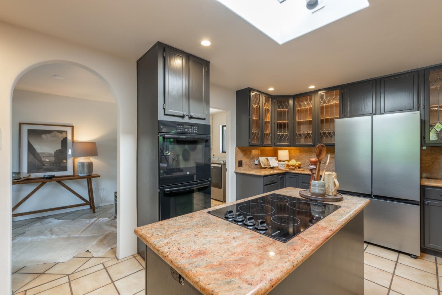 19 El Caminito Road Carmel Valley, CA 93924 - Photo 15 of 50 a kitchen with a refrigerator and a stove top oven