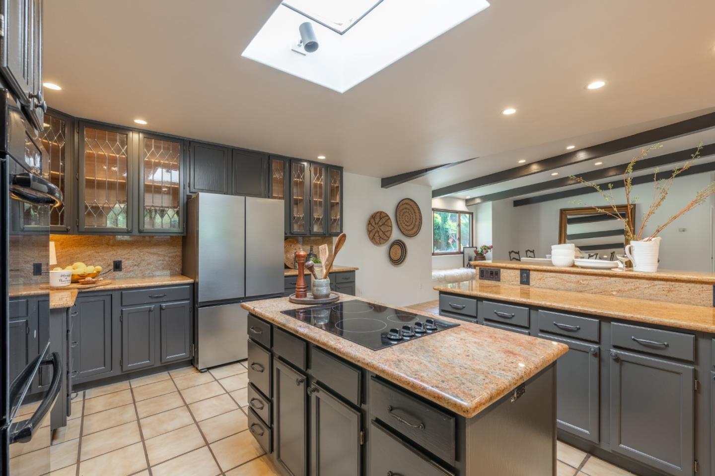 19 El Caminito Road Carmel Valley, CA 93924 - Photo 16 of 50 a kitchen with granite countertop a sink stove and refrigerator
