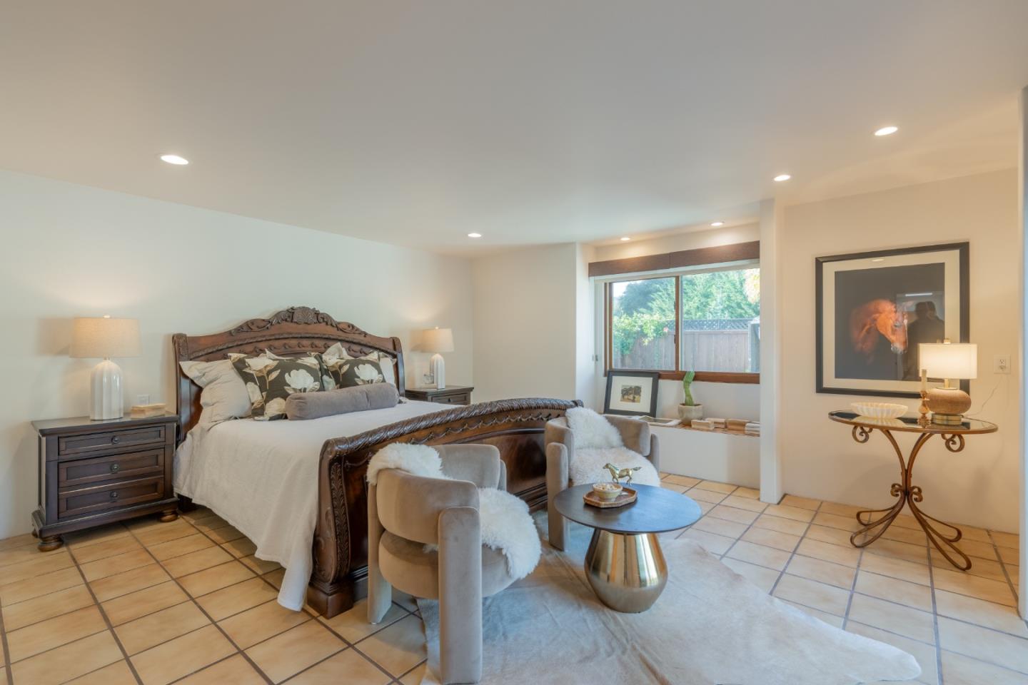 19 El Caminito Road Carmel Valley, CA 93924 - Photo 20 of 50 a bedroom with a bed and large window