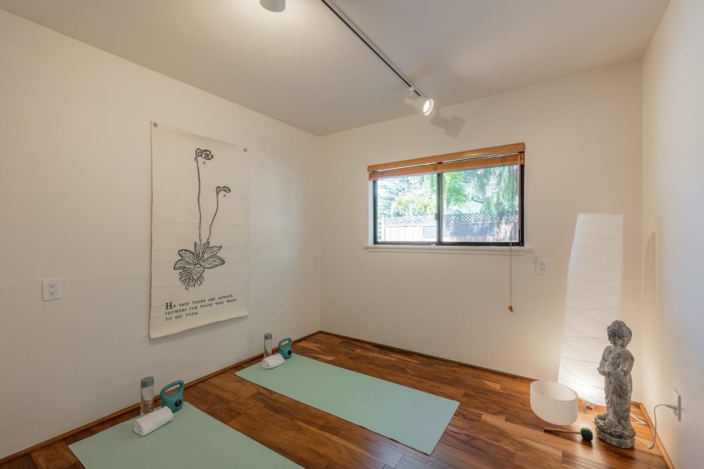 19 El Caminito Road Carmel Valley, CA 93924 - Photo 25 of 50 a room with painting on the wall and a window