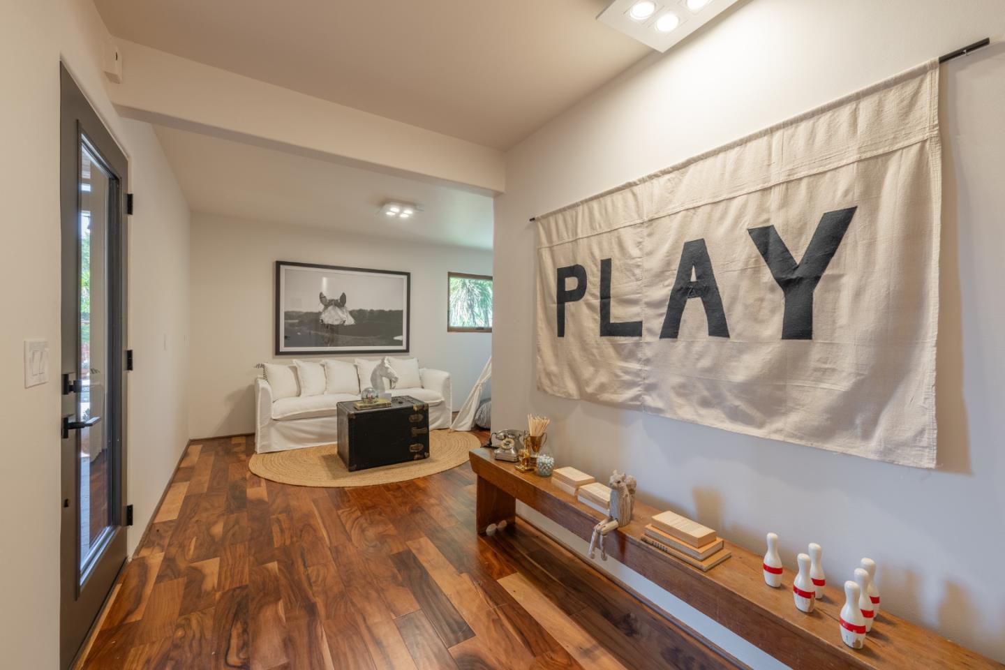 19 El Caminito Road Carmel Valley, CA 93924 - Photo 26 of 50 a living room with furniture and a wooden floor