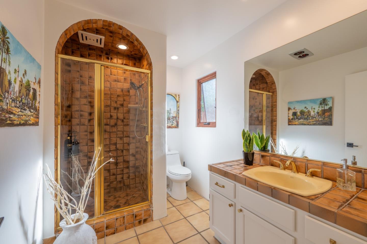 19 El Caminito Road Carmel Valley, CA 93924 - Photo 28 of 50 a spacious bathroom with a granite countertop sink a toilet and shower