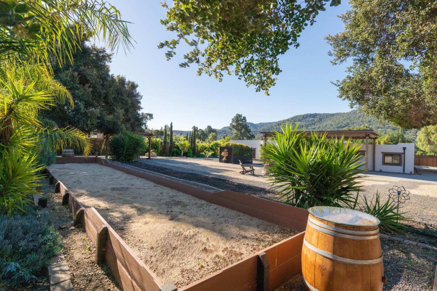 19 El Caminito Road Carmel Valley, CA 93924 - Photo 35 of 50 a view of a backyard with plants and a garden
