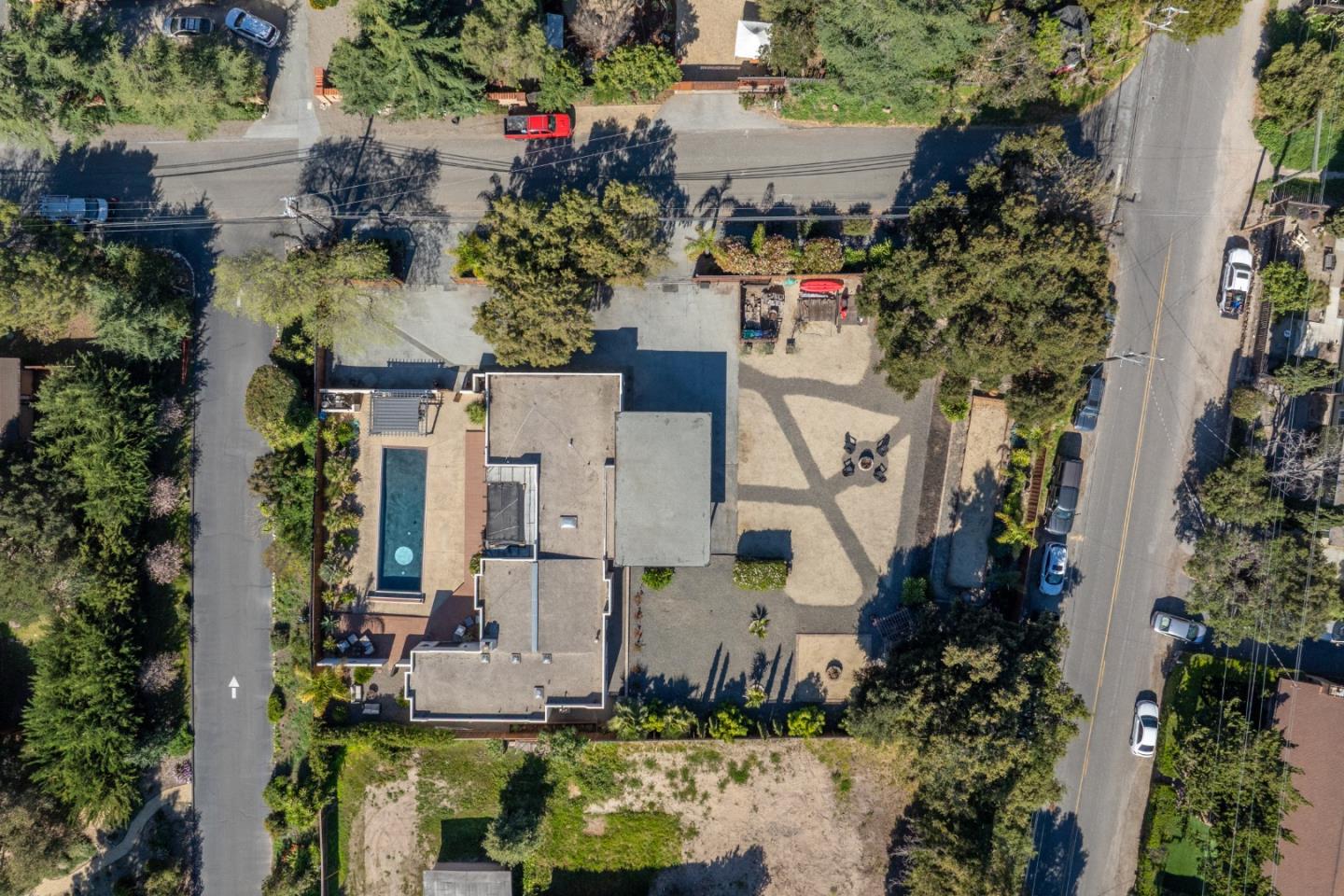 19 El Caminito Road Carmel Valley, CA 93924 - Photo 40 of 50 an aerial view of a house with a yard and large trees