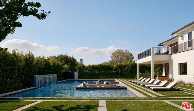 a view of a swimming pool with lounge chair