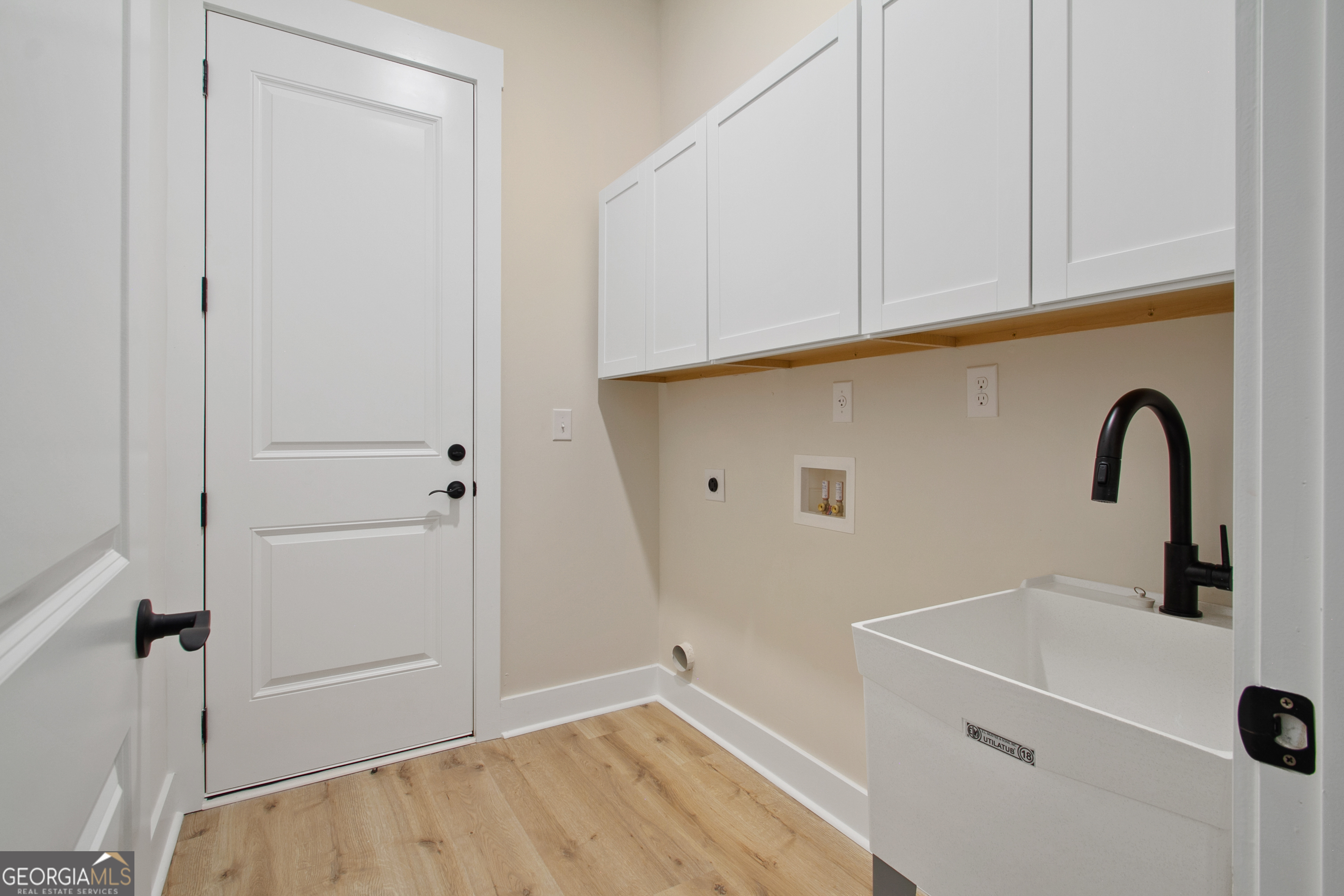 312 Clover Pass Forsyth, GA 31029 - Photo 22 of 22 a bathroom with a sink and vanity