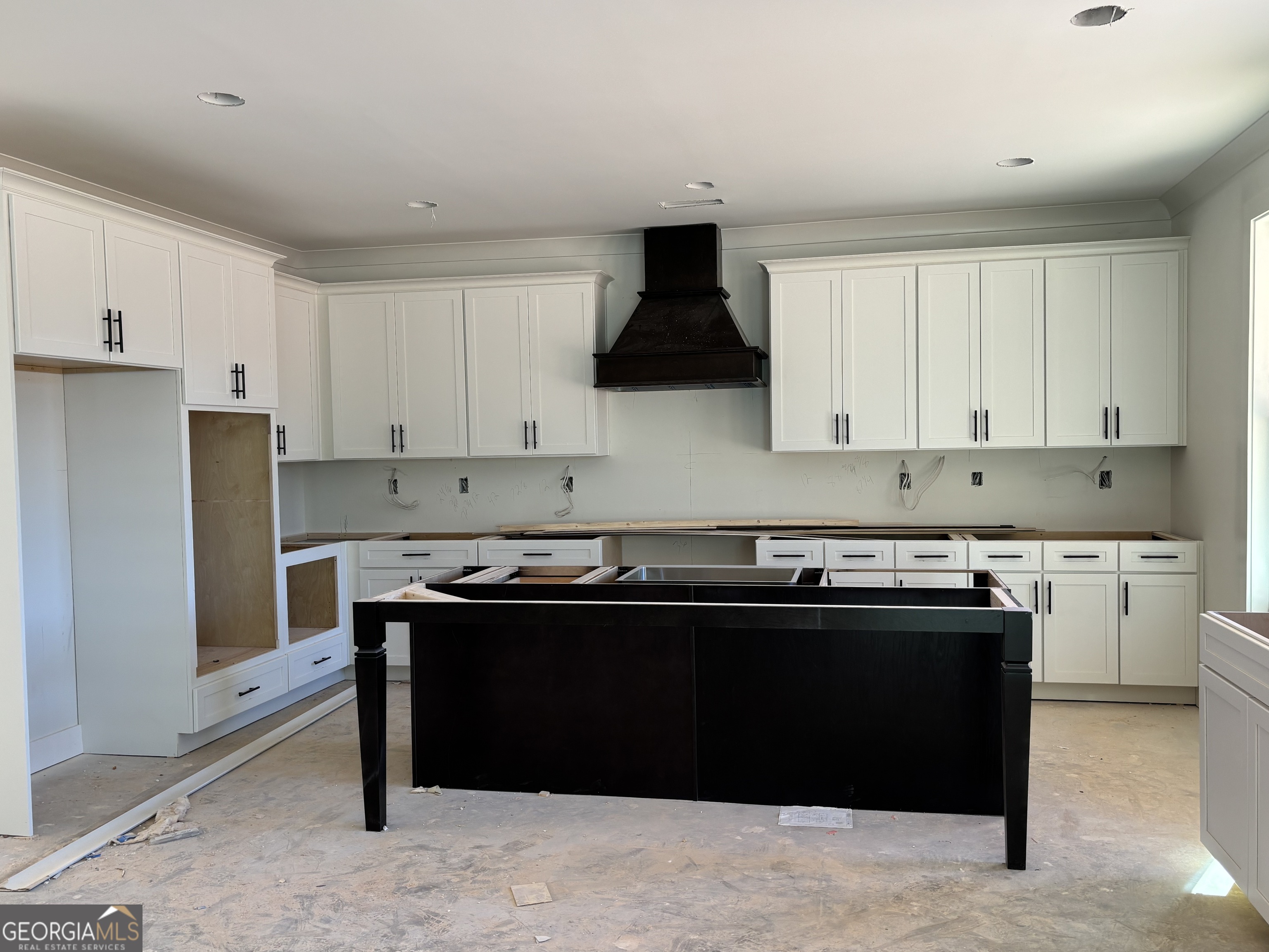 312 Clover Pass Forsyth, GA 31029 - Photo 3 of 22 a kitchen with a sink and cabinets