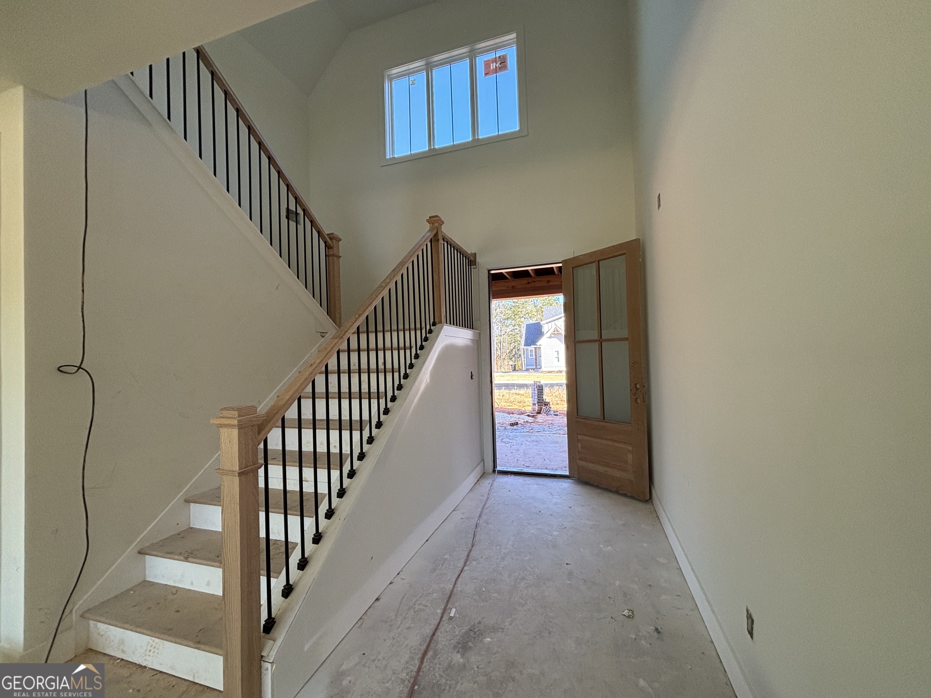 312 Clover Pass Forsyth, GA 31029 - Photo 4 of 22 a view of entryway and hall with wooden floor