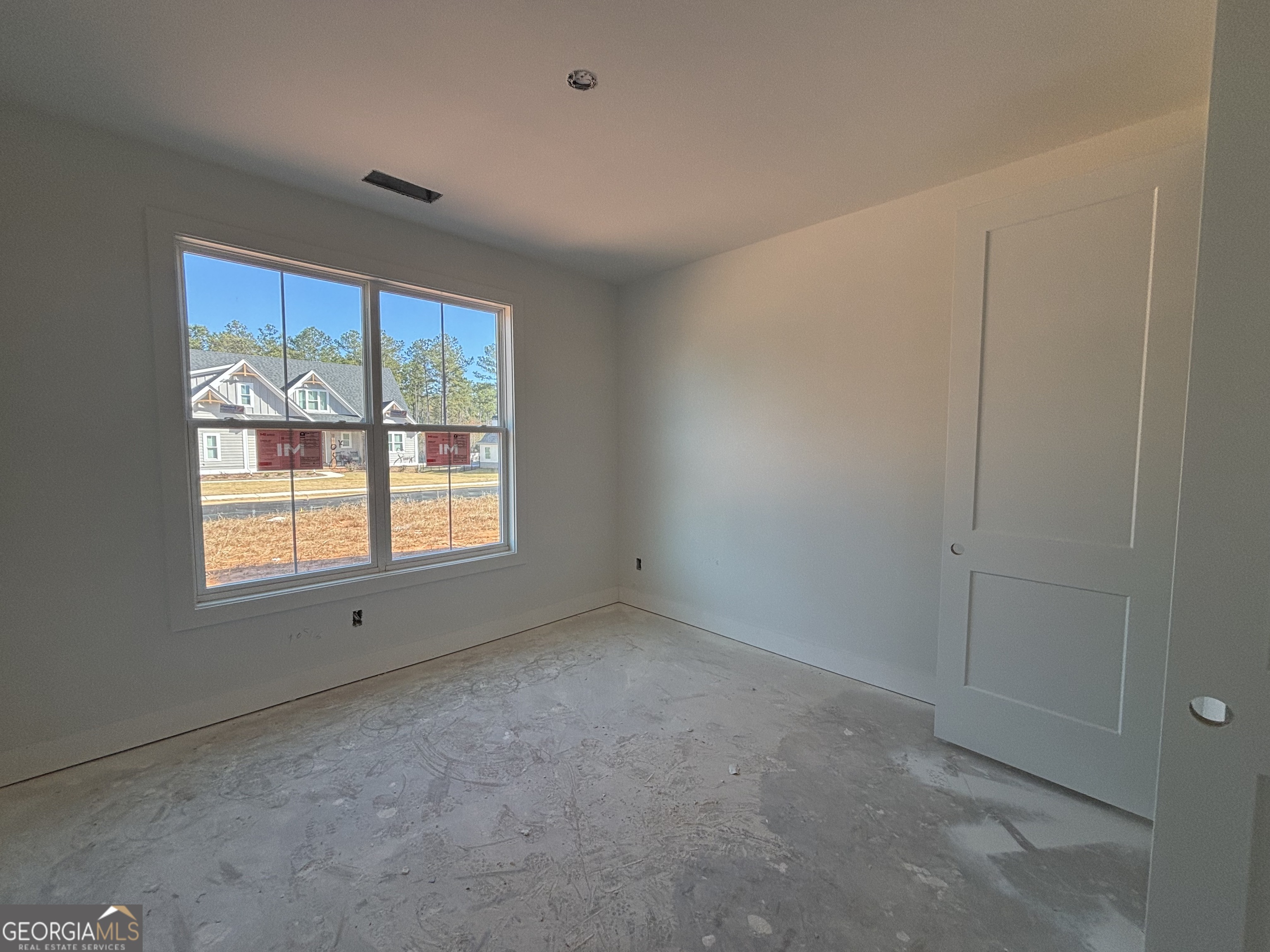 312 Clover Pass Forsyth, GA 31029 - Photo 6 of 22 an empty room with a window