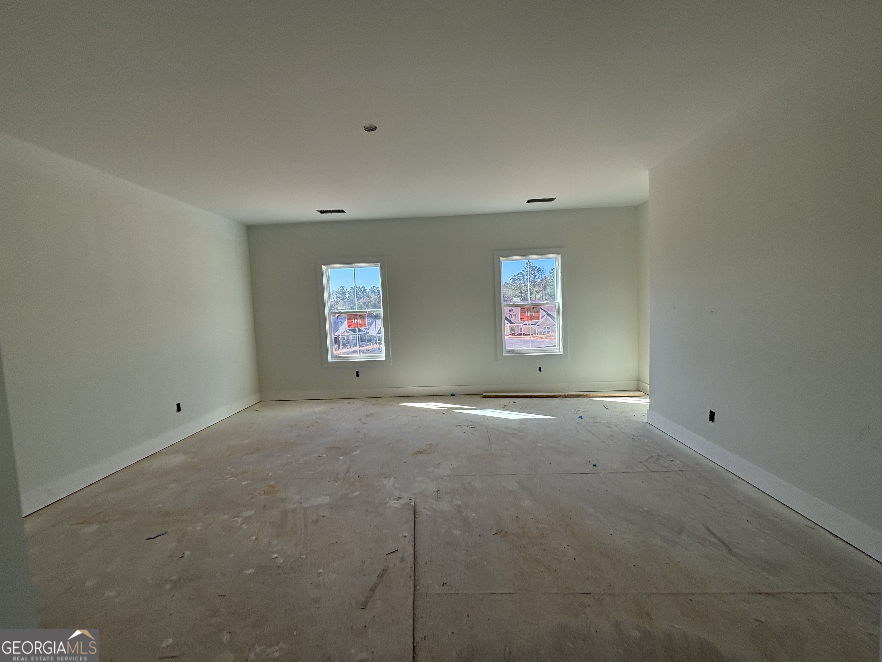 312 Clover Pass Forsyth, GA 31029 - Photo 8 of 22 a view of an empty room with a window