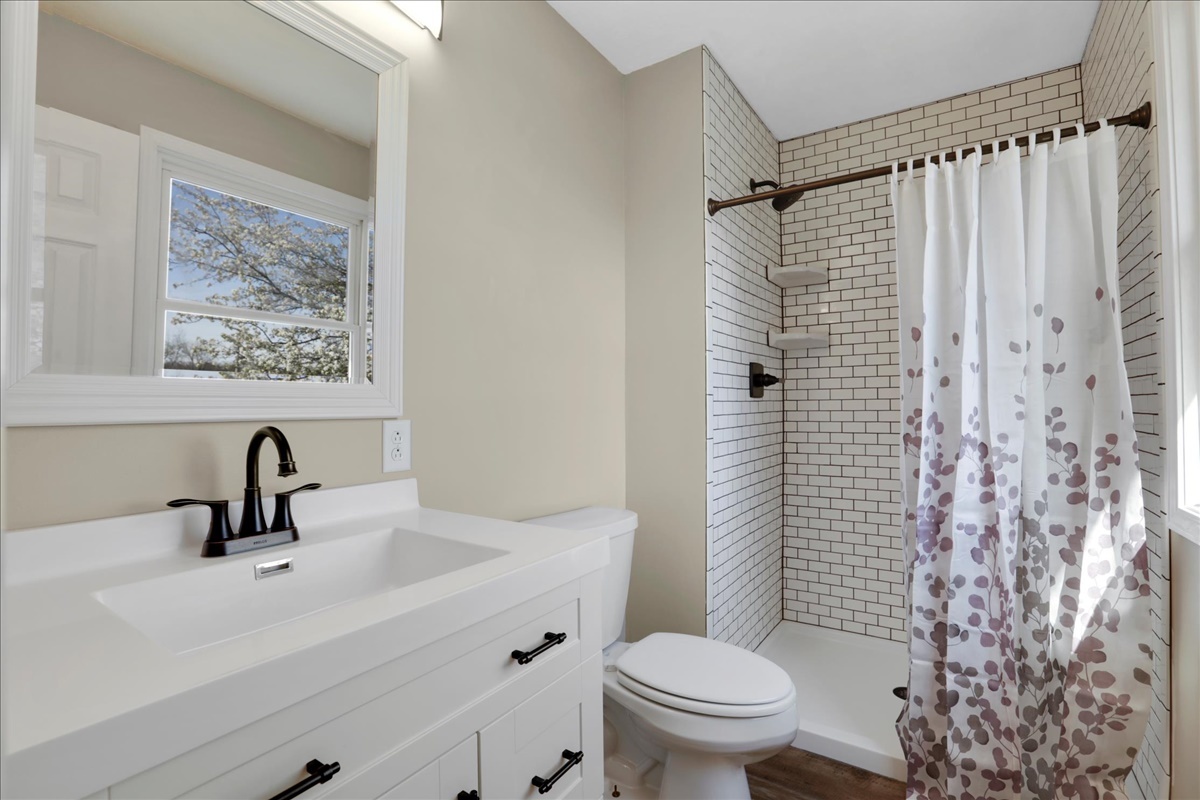17105 Clinton Road Danville, IL 61834 - Photo 17 of 31 a bathroom with a sink toilet and shower