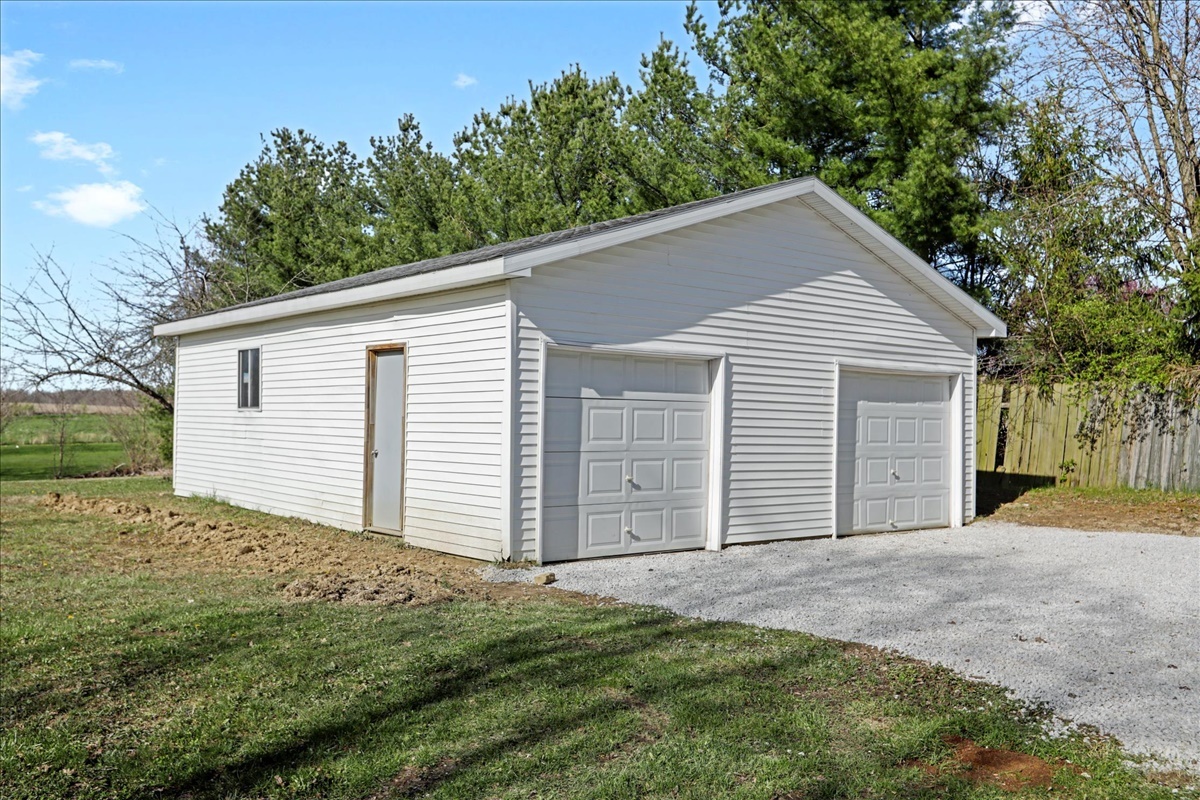 17105 Clinton Road Danville, IL 61834 - Photo 27 of 31 a front view of a house with a yard and garage