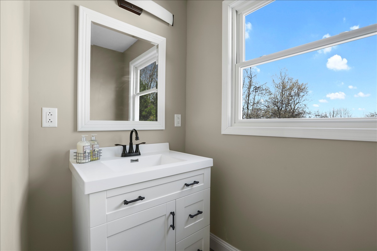 17105 Clinton Road Danville, IL 61834 - Photo 9 of 31 a bathroom with a sink and a mirror
