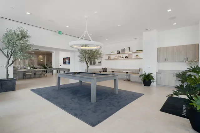 a view of a swimming pool with outdoor seating and city view