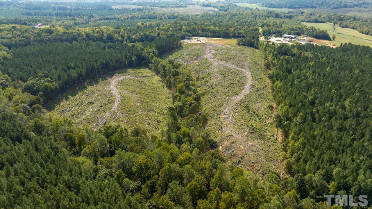 1050 Lawson Farm Road Roxboro, NC 27574 - Photo 16 of 19 an aerial view of residential houses with outdoor space and trees