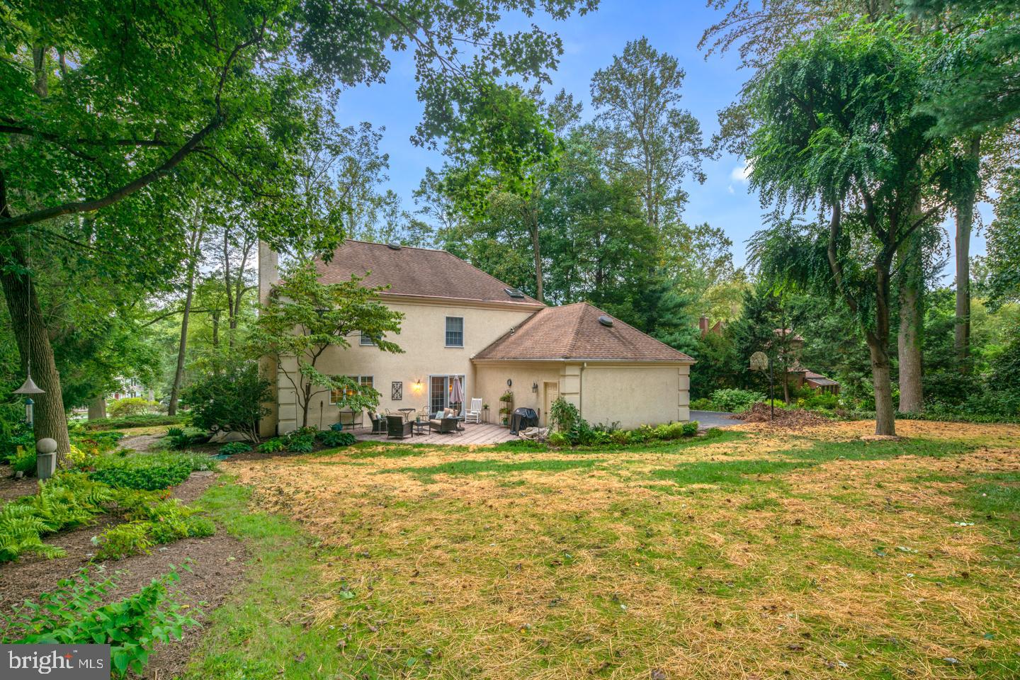 205 Pembroke Road Wallingford, PA 19086 - Photo 22 of 43 a big house with a big yard and large trees